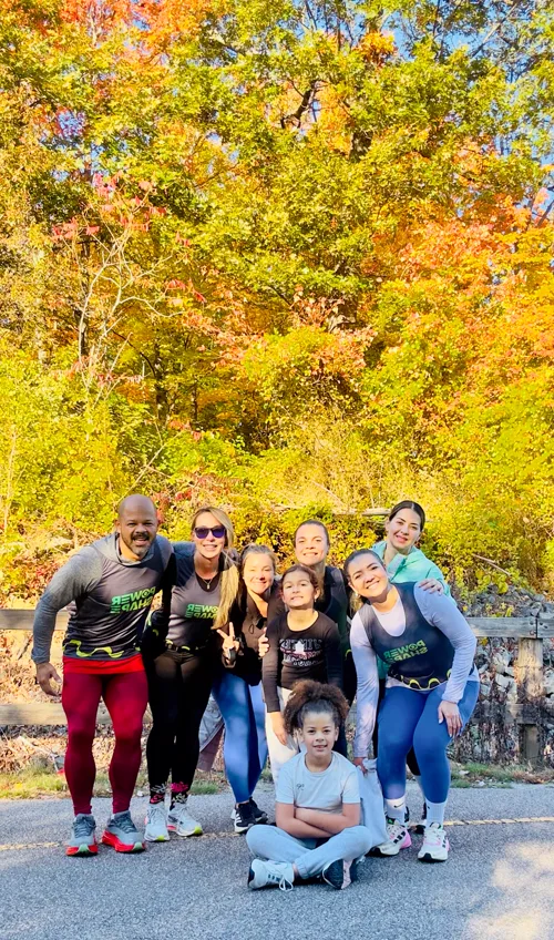 Adults and children together outdoors in autumn